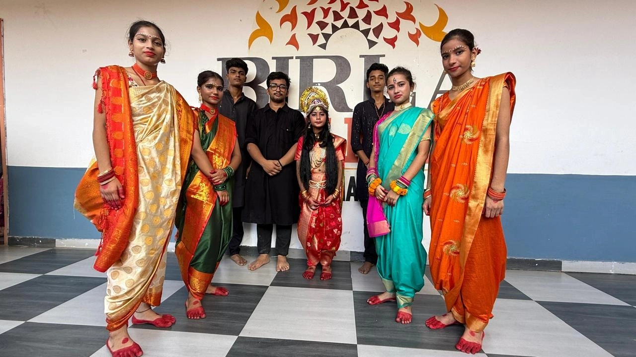 Students in traditional costumes after a cultural performance at BOMIS Naubatpur