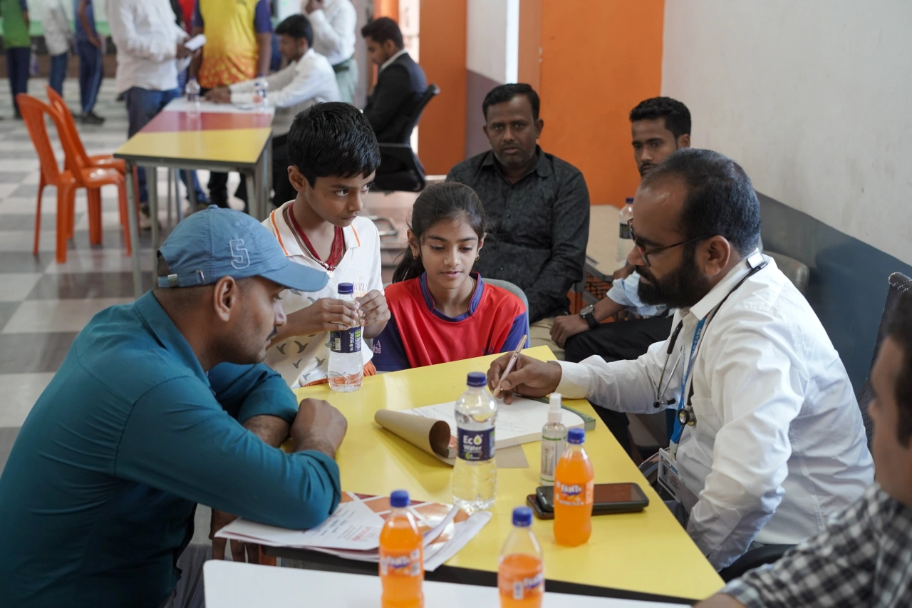 School community participating in the March 2026 medical camp at BOMIS Naubatpur